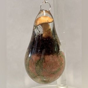 Golden mushroom with moss on a unikite sphere